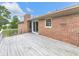 Wooden deck provides an outdoor living space with brick exterior and sliding glass doors at 104 Cochran Ridge Rd, Dallas, GA 30157