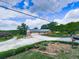 Traditional brick home with attached garage, surrounded by lush landscaping and a circular driveway at 104 Cochran Ridge Rd, Dallas, GA 30157