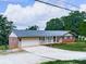 Front exterior of house with garage and brick siding at 104 Cochran Ridge Rd, Dallas, GA 30157