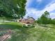 Home's front yard showing the grass and front of house at 104 Cochran Ridge Rd, Dallas, GA 30157
