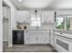 Bright kitchen featuring white cabinets, modern appliances, and a window over the sink at 104 Cochran Ridge Rd, Dallas, GA 30157