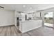 Open-concept kitchen featuring an island with a breakfast bar and modern appliances at 104 Cochran Ridge Rd, Dallas, GA 30157