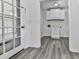 Functional laundry room with white cabinets, gray floors, and a door to the garage at 104 Cochran Ridge Rd, Dallas, GA 30157