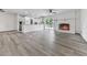 Spacious living room featuring an open-concept kitchen, fireplace, and a bright sliding door at 104 Cochran Ridge Rd, Dallas, GA 30157