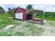 View of detached garage and carport on a spacious lot with mature trees at 104 Cochran Ridge Rd, Dallas, GA 30157