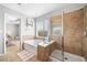 Bathroom featuring a soaking tub, glass enclosed shower, and lots of natural light at 501 White Oak Path, Canton, GA 30115