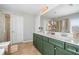 Bathroom with a double sink vanity, quartz countertops, and tiled floors at 501 White Oak Path, Canton, GA 30115