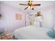 Bedroom with lavender walls and a white comforter at 501 White Oak Path, Canton, GA 30115