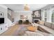 Inviting living room featuring a fireplace, hardwood floors, and plush furniture at 501 White Oak Path, Canton, GA 30115