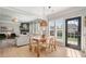 Open concept living room and dining area offers lots of windows and natural light at 501 White Oak Path, Canton, GA 30115