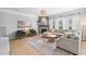Bright living room with hardwood floors, fireplace, and comfortable seating at 501 White Oak Path, Canton, GA 30115