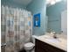 Bright bathroom with a vanity, toilet, shower, and stylish decor at 5976 Rosie Se Ln, Mableton, GA 30126