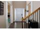 Grand foyer featuring hardwood floors, elegant columns, and abundant natural light at 5976 Rosie Se Ln, Mableton, GA 30126