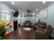 Comfortable living room featuring a fireplace, hardwood floors, and ample seating at 5976 Rosie Se Ln, Mableton, GA 30126