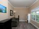 Cozy living room with a comfortable couch, ample natural light, and wood-look flooring at 5976 Rosie Se Ln, Mableton, GA 30126