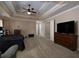 Large main bedroom with neutral walls, a ceiling fan, and a dark, cozy bed at 5976 Rosie Se Ln, Mableton, GA 30126