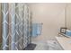Neat bathroom with a shower and tub combination, complemented by tasteful decor, and a well-maintained toilet at 1201 Bridle Path, Marietta, GA 30068