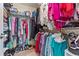 Walk-in closet with custom shelving for optimal organization at 1201 Bridle Path, Marietta, GA 30068