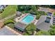Aerial view of the pool surrounded by sun loungers, trees, and buildings making it a community focal point at 1201 Bridle Path, Marietta, GA 30068