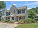 Charming two-story townhome with gray brick and siding, complemented by a well-maintained front yard at 1201 Bridle Path, Marietta, GA 30068