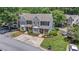 Well-maintained townhouses with charming curb appeal, beautifully landscaped grounds, and ample parking for residents at 1201 Bridle Path, Marietta, GA 30068
