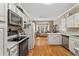 Well-equipped kitchen with stainless steel appliances, ample cabinetry, and an open flow to the living area at 1201 Bridle Path, Marietta, GA 30068