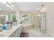 Main bathroom with dual sinks, separate shower, soaking tub, and lots of sunlight at 1201 Bridle Path, Marietta, GA 30068
