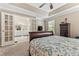 Main bedroom with French doors leading into main bathroom with view of backyard at 1201 Bridle Path, Marietta, GA 30068