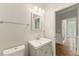 Elegant bathroom featuring a modern vanity, sleek fixtures, and a neutral color palette at 1502 Lake Koinonia Dr, Woodstock, GA 30189