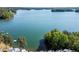 Scenic aerial view of lake and houses at 2300 Harbersham Marina Rd # 102, Cumming, GA 30041