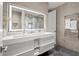 Elegant bathroom featuring double vanity, illuminated mirror, and heated towel rack at 2300 Harbersham Marina Rd # 102, Cumming, GA 30041