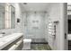 Modern bathroom with a glass shower, rainfall shower head and pebble shower floor at 2300 Harbersham Marina Rd # 102, Cumming, GA 30041