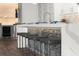 Modern kitchen features a breakfast bar, stainless steel appliances, and unique rock-filled cabinet fronts at 2300 Harbersham Marina Rd # 102, Cumming, GA 30041