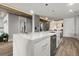 Spacious kitchen island with stainless steel dishwasher and microwave in a modern open-concept kitchen at 2300 Harbersham Marina Rd # 102, Cumming, GA 30041