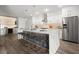 Modern kitchen with a waterfall island, stainless steel appliances, and bar stool seating at 2300 Harbersham Marina Rd # 102, Cumming, GA 30041