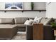 Relaxing living room featuring a large sectional sofa, hardwood floors, and nautical decor at 2300 Harbersham Marina Rd # 102, Cumming, GA 30041