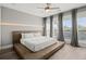 Bright main bedroom with modern furnishings, large windows, and a stylish platform bed at 2300 Harbersham Marina Rd # 102, Cumming, GA 30041