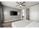 Spacious main bedroom featuring modern lighting, a TV, and neutral decor at 2300 Harbersham Marina Rd # 102, Cumming, GA 30041