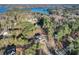 Expansive aerial view showcasing the property's proximity to a beautiful lake and lush, wooded surroundings at 3785 Pilgrim Mill Rd, Cumming, GA 30041