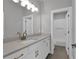 A bathroom with a white vanity and ample lighting at 3785 Pilgrim Mill Rd, Cumming, GA 30041
