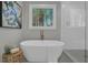 Bright bathroom featuring a soaking tub, walk-in shower, and an attractive window at 3785 Pilgrim Mill Rd, Cumming, GA 30041