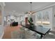 Bright dining area with modern chandelier, flows into a kitchen with white cabinetry and a central island at 3785 Pilgrim Mill Rd, Cumming, GA 30041