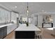 Spacious kitchen with large island, stainless steel appliances, and a seamless flow to dining area at 3785 Pilgrim Mill Rd, Cumming, GA 30041