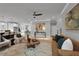 Open concept living space with hardwood floors, stylish furniture, and a cozy seating area perfect for relaxing and entertaining at 3785 Pilgrim Mill Rd, Cumming, GA 30041