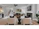 Bright living room featuring hardwood floors, a fireplace, and modern decor, creating a warm and inviting atmosphere at 3785 Pilgrim Mill Rd, Cumming, GA 30041
