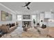 Cozy living room features a fireplace, modern furniture, and hardwood floors at 3785 Pilgrim Mill Rd, Cumming, GA 30041