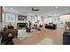 Stylish open-concept living room featuring a fireplace, modern furniture, and access to the kitchen at 3785 Pilgrim Mill Rd, Cumming, GA 30041