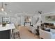 Open-concept living room featuring hardwood floors, modern decor, and a cozy seating area at 3785 Pilgrim Mill Rd, Cumming, GA 30041