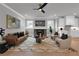Cozy living room with a fireplace, modern decor, and large windows, creating an inviting space at 3785 Pilgrim Mill Rd, Cumming, GA 30041