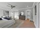 Spacious main bedroom with hardwood floors, sitting area, a ceiling fan, and multiple closets at 3785 Pilgrim Mill Rd, Cumming, GA 30041